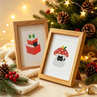 Completed Christmas Black Cats mini diamond painting shown as framed decor