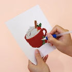 Applying drills to a Christmas Desserts mini diamond painting design