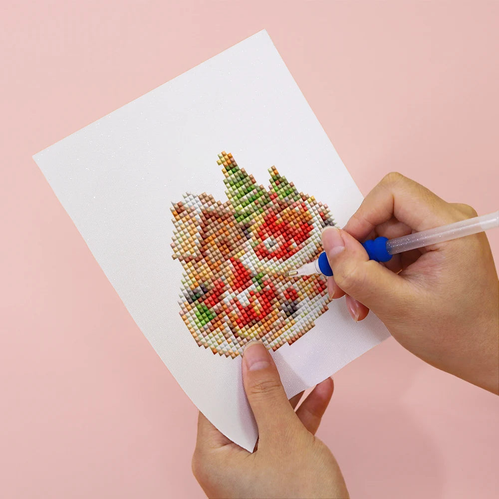 Applying drills to a Christmas Treats & Sweets mini diamond painting design