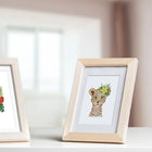 Framed Colourful Animal Friends mini diamond painting artwork displayed in a styled setting