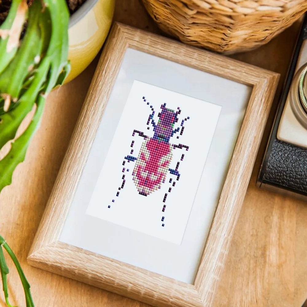Completed Colourful Beetles mini diamond painting shown as framed decor