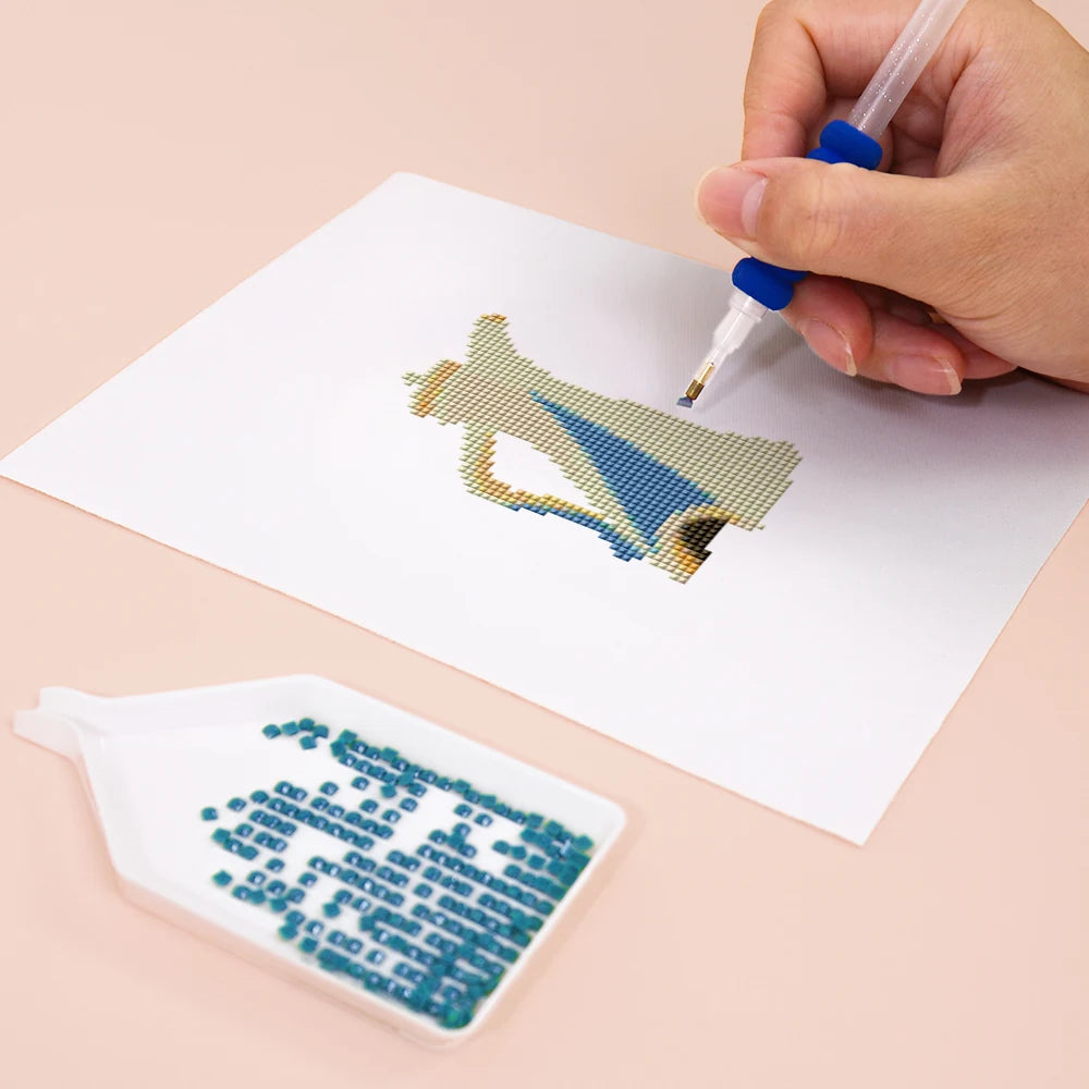 Close-up of drills being placed on a Colourful Teapots mini diamond painting design