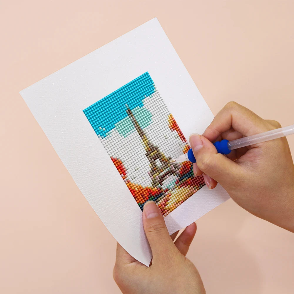 Applying drills to a Colourful Travel Postcards mini diamond painting design