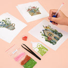 Working on several Cottage Garden Teacups mini diamond painting designs with drills and applicator