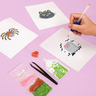 Working on several Cute Halloween Icons mini diamond painting designs with drills and applicator