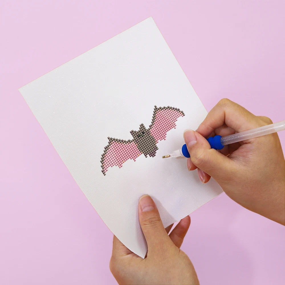 Applying drills to a Cute Halloween Icons mini diamond painting design