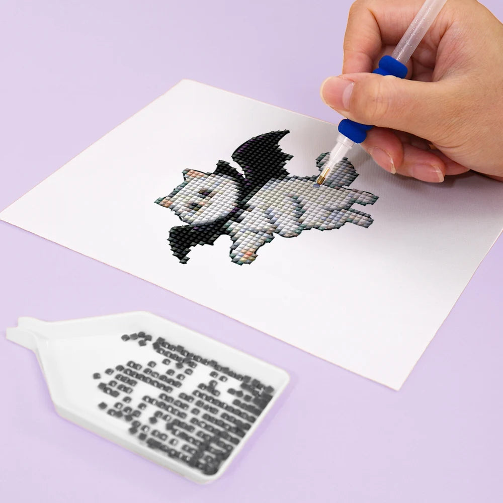 Close-up of drills being placed on a Cute Halloween Pets mini diamond painting design