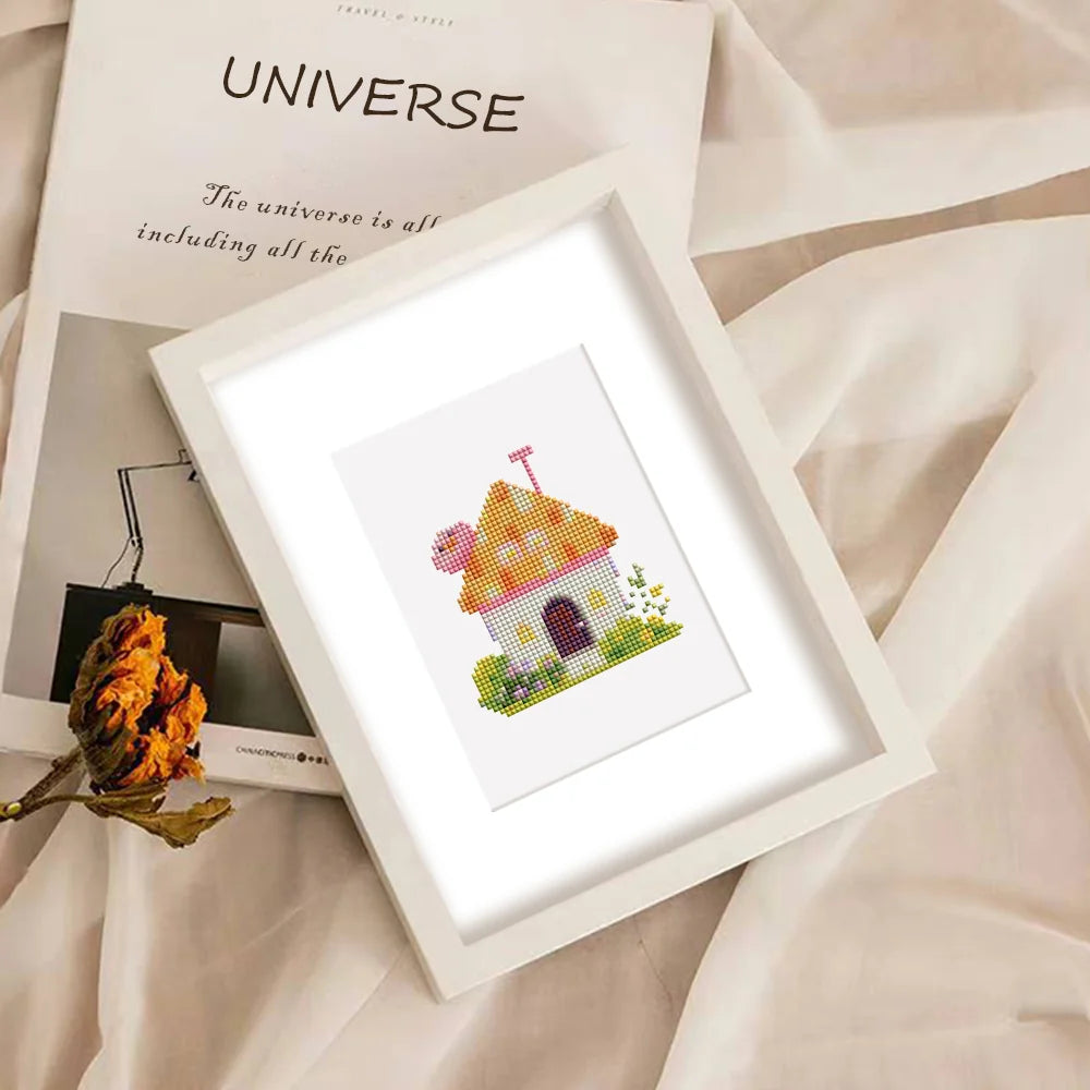 Completed Fairy Garden Cottages mini diamond painting shown as framed decor