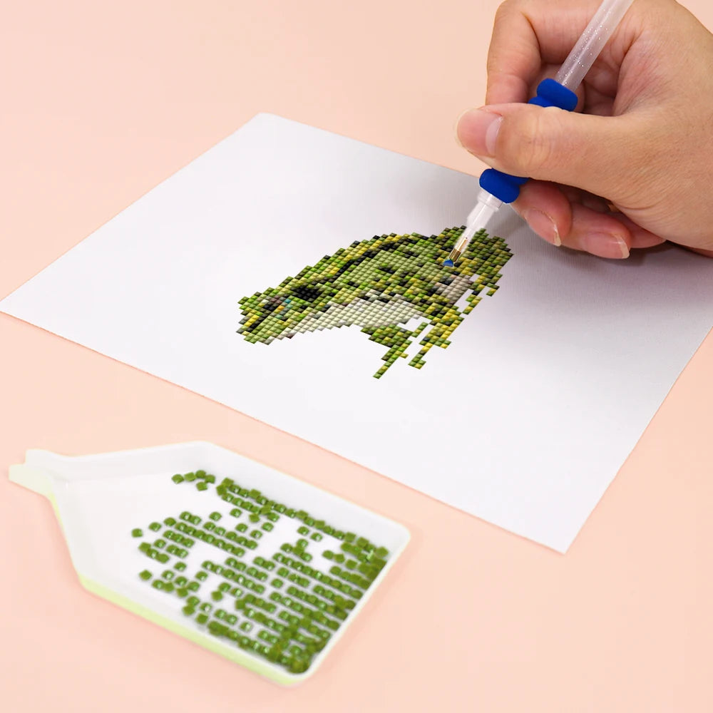 Close-up of drills being placed on a Frogs, Lizards & Chameleons mini diamond painting design