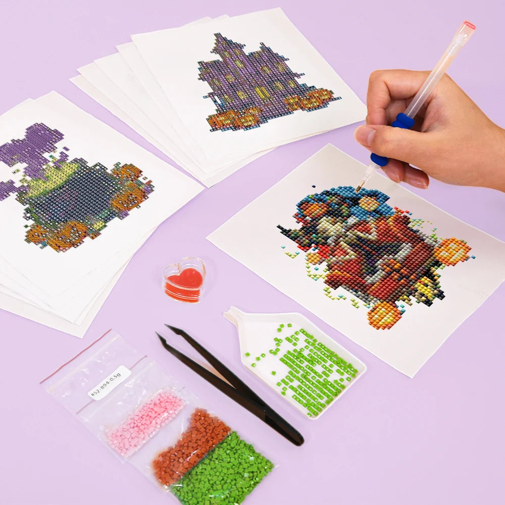 Working on several Gothic Halloween Night mini diamond painting designs with drills and applicator