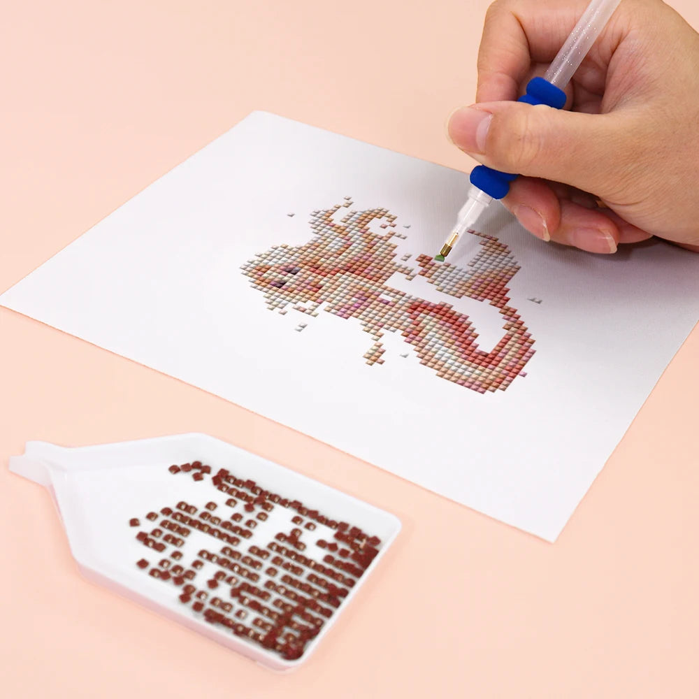 Close-up of drills being placed on a Pastel Mermaids mini diamond painting design