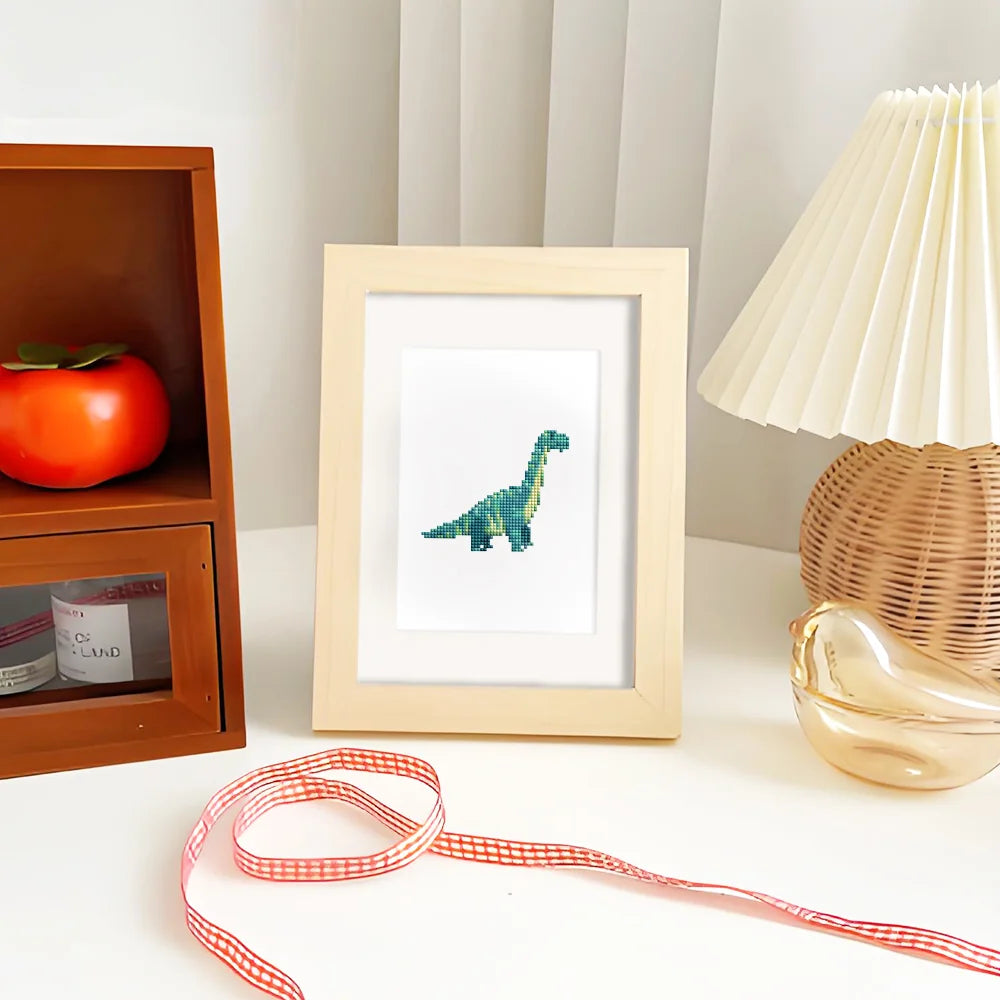 Framed Playful Dinosaurs mini diamond painting artwork presented as finished decor