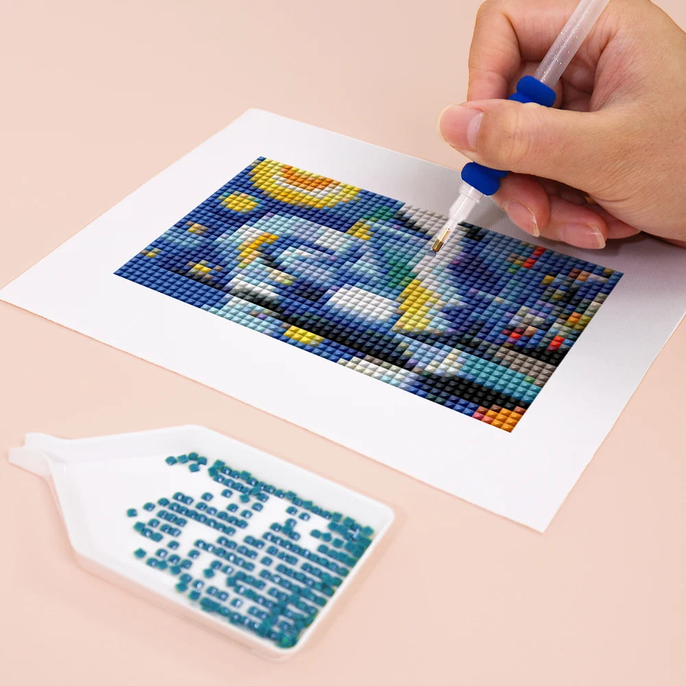 Close-up of drills being placed on a Pop Art Masterpieces mini diamond painting design