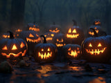 Glowing jack-o'-lantern pumpkins in orange against a dark blue night