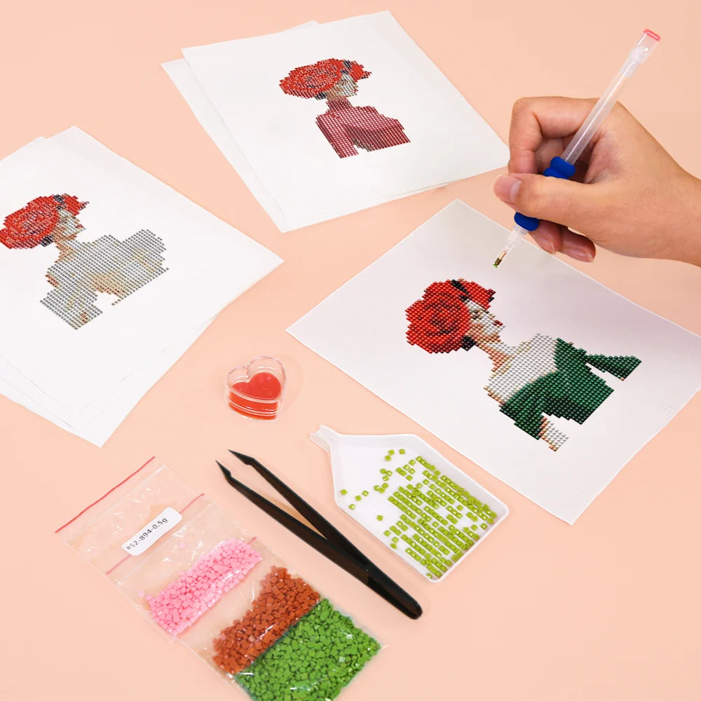 Working on several Red Rose Fashion mini diamond painting designs with drills and applicator