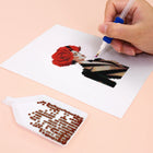 Close-up of drills being placed on a Red Rose Fashion mini diamond painting design