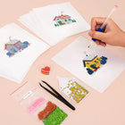Working on several Tiny Village Houses mini diamond painting designs with drills and applicator