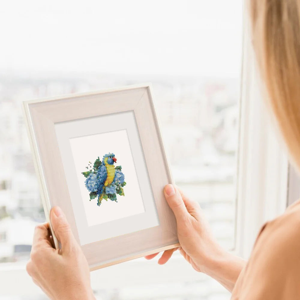 Completed Tropical Birds & Blooms mini diamond painting shown as framed decor
