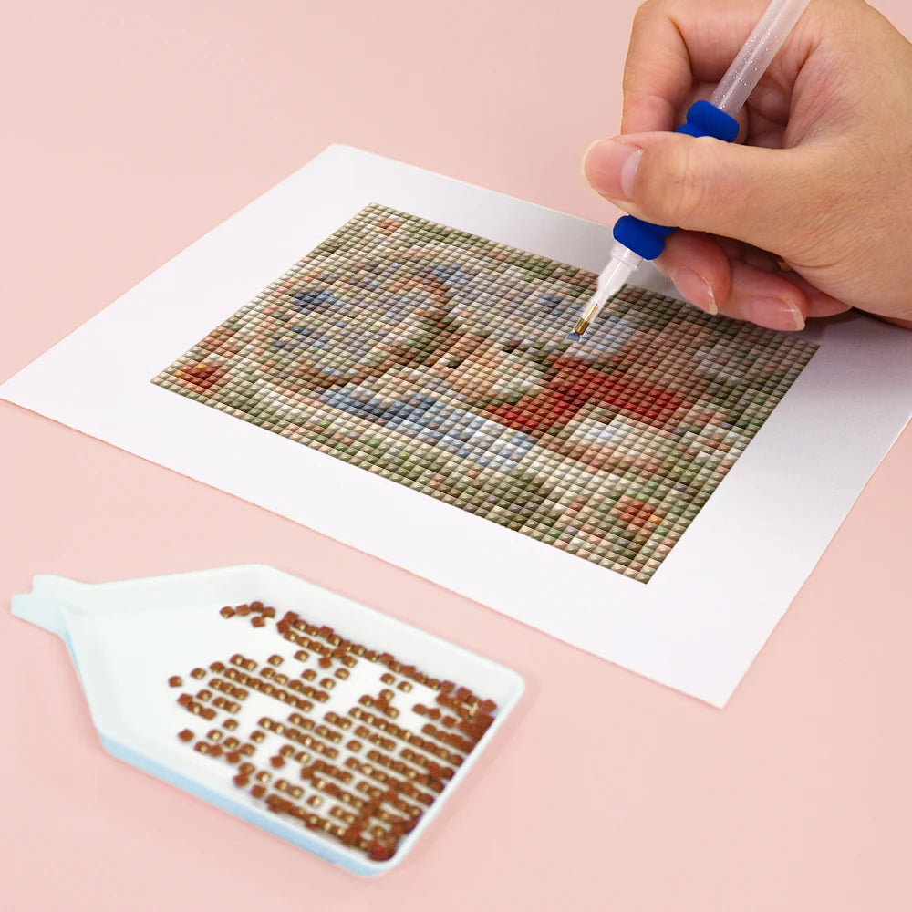 Close-up of drills being placed on a Vintage Christmas Windows mini diamond painting design