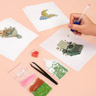 Working on several Whimsical Cottage Finds mini diamond painting designs with drills and applicator