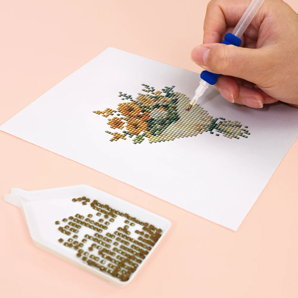 Close-up of drills being placed on a Whimsical Cottage Finds mini diamond painting design