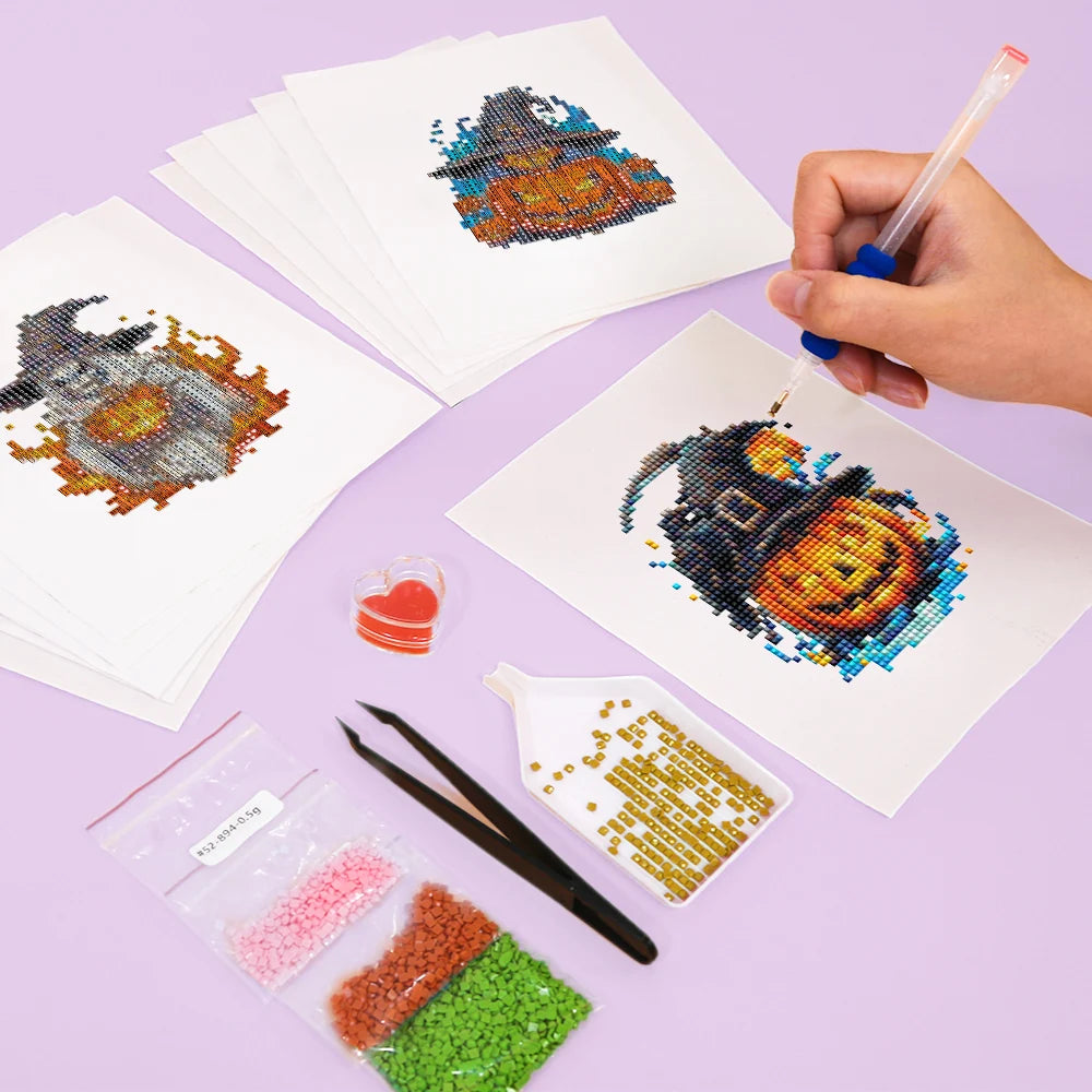 Working on several Witchy Pumpkin Parade mini diamond painting designs with drills and applicator
