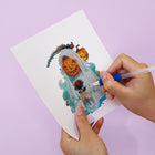 Applying drills to a Witchy Pumpkin Parade mini diamond painting design