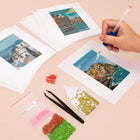 Working on several World Landmarks mini diamond painting designs with drills and applicator